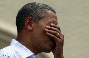 U.S. President Obama wipes perspiration from his face while speaking at a campaign event at Carnegie Mellon University in Pittsburgh